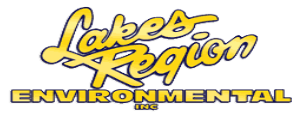 A yellow and white logo for lakes region ironmen.
